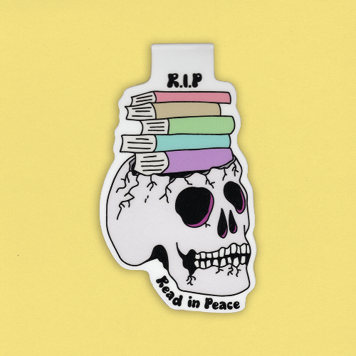 taitettu kirjanmerkki pääkallosta, jonka päällä on kirjoja. kirjanmerkissä lukee R.I.P Read in Peace